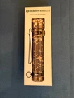 Olight Warrior Mini 2 1750 Lumen Rechargeable Flashlight, Desert Camouflage New. Price: $105.95.