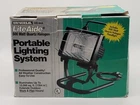 Universal Liteaide 500 Watt Quartz Halogen Portable Lighting System New Box Open. Price: $20.00.