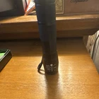 Black Led Metal Handheld Flashlight With Wrist Strap New. Price: $5.00.