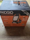 Ridgid 18V Cordless Flood Light Kit With 2.0 Ah Battery And Charger R86902KSB Open. Price: $65.00.
