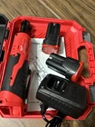 Milwaukee M18 Cordless Ratchet Kit, 2 Li-ion Batteries, Charger, Red/black New. Price: $214.99.
