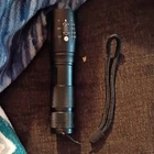Black Led Adjustable Focus Cordless Flashlight With Wrist Strap, Metal Used. Price: $15.00.